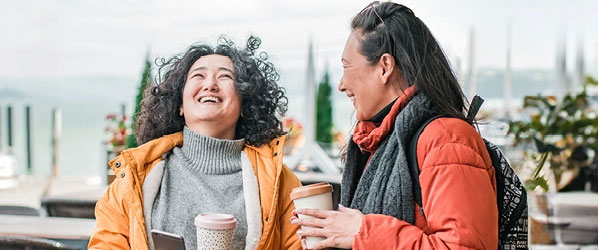 Two friends chatting over coffee